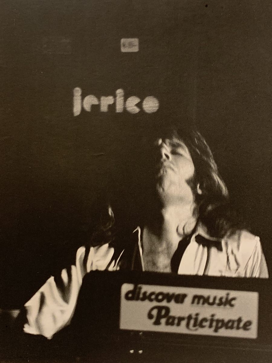 Gregg Owen playing keyboards on stage with Jerico
